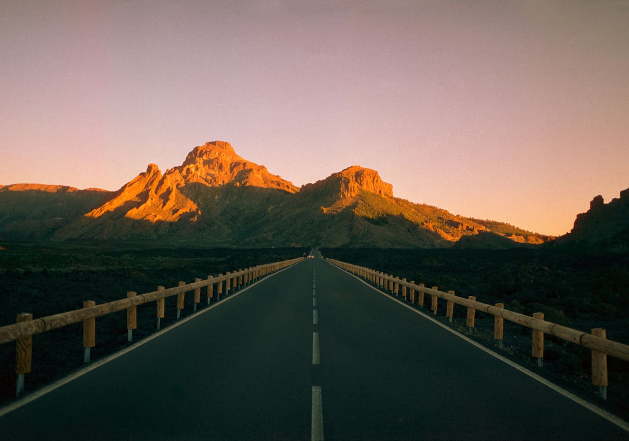 An open road through a sunset landscape — payments that go through anywhere